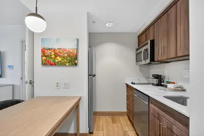 a kitchen with a counter top and a microwave at Homewood Suites by Hilton Carlsbad-North San Diego County in Carlsbad