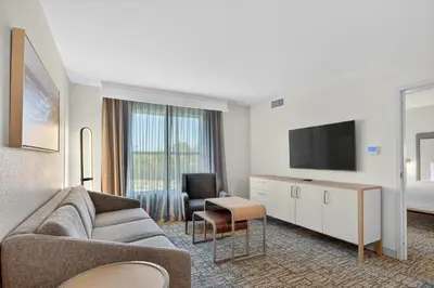 a living room with a couch and a tv at Homewood Suites by Hilton Carlsbad-North San Diego County in Carlsbad