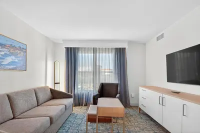 a living room with a couch and a chair at Homewood Suites by Hilton Carlsbad-North San Diego County in Carlsbad