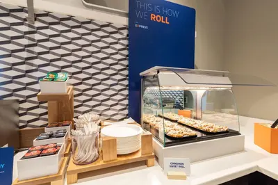 a display case with donuts and other pastries at Holiday Inn Express Temecula by IHG in Temecula