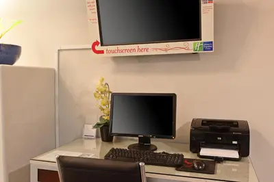 a desk with a computer monitor and a printer at Holiday Inn Express Temecula by IHG in Temecula
