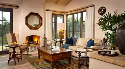 a living room with a couch and a fireplace at Rancho Valencia Resort and Spa in Rancho Santa Fe