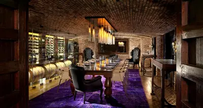 a long dining room with a long table and chairs at Rancho Valencia Resort and Spa in Rancho Santa Fe