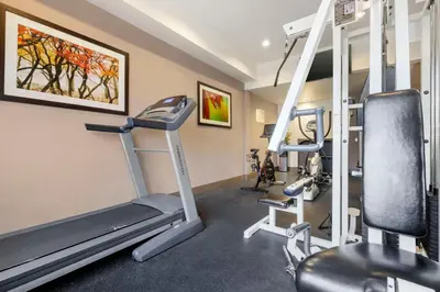 a gym with two tread machines and a treadmill at Best Western Plus Lake Elsinore Inn & Suites in Lake Elsinore