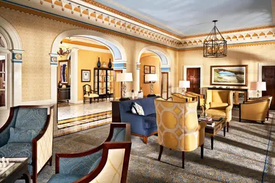 a living room with a couch and chairs at Grande Colonial La Jolla in San Diego