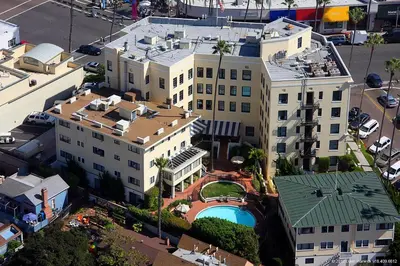 an overhead view of a large building with a pool at Grande Colonial La Jolla in San Diego