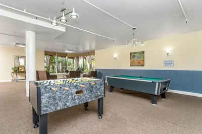 a room with two ping pong tables in it at Condo in Beachfront Resort B-212 in Oceanside