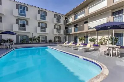 a swimming pool in front of a building at Comfort Inn San Diego Old Town in San Diego