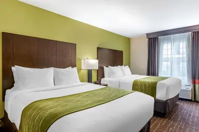 a hotel room with two beds and a window at Comfort Inn San Diego Old Town in San Diego