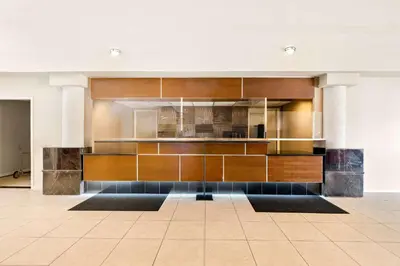 a kitchen with wooden cabinets in a building at Best Western Plus Irvine Spectrum Hotel in Lake Forest