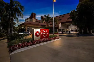 a best western plus sign in front of a building at Best Western Plus Irvine Spectrum Hotel in Lake Forest