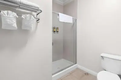 a bathroom with a shower and a toilet at Best Western Plus Irvine Spectrum Hotel in Lake Forest