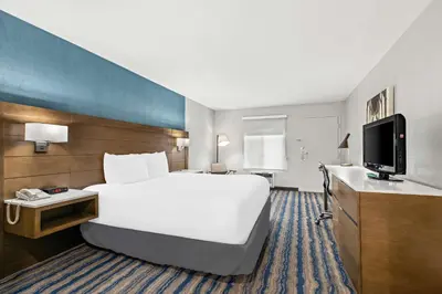 a hotel room with a large bed and a tv at Best Western Chula Vista/Otay Valley Hotel in Chula Vista