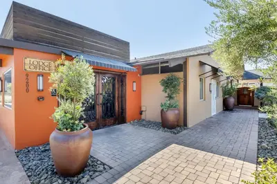 an entrance to a home office with potted plants at Carlton Oaks Lodge, an Ascend Collection Hotel in Santee