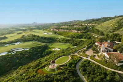 an aerial view of the golf course at a resort at The Resort at Pelican Hill in Crystal Cove