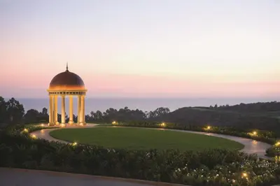 a garden with a gazebo at night at The Resort at Pelican Hill in Crystal Cove