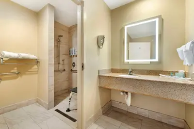 a bathroom with a sink and a shower at Best Western Oceanside Inn in Oceanside