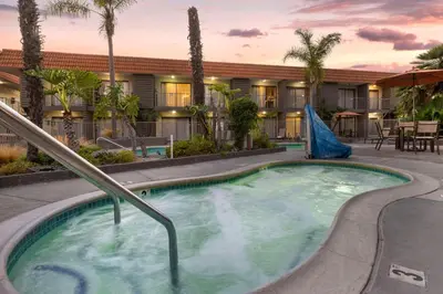 a hot tub in the courtyard of a resort at Best Western Oceanside Inn in Oceanside