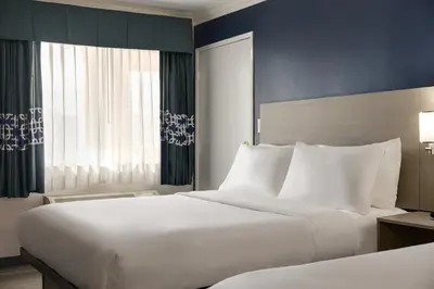 a hotel room with a large bed and a window at Quality Inn Lake Elsinore I-15 in Lake Elsinore