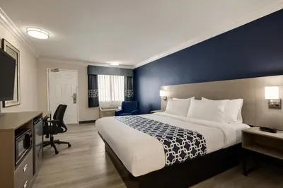 a hotel room with a bed and a desk at Quality Inn Lake Elsinore I-15 in Lake Elsinore