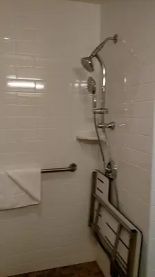 a bathroom with a shower with a shower head at Old Town Inn in San Diego