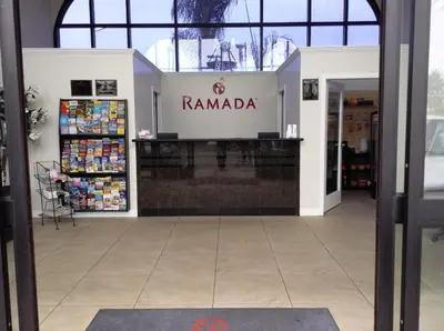a store front with a sign that reads ramada at Ramada by Wyndham Oceanside in Oceanside