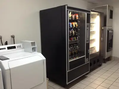 a refrigerator filled with lots of bottles of beer at Ramada by Wyndham Oceanside in Oceanside