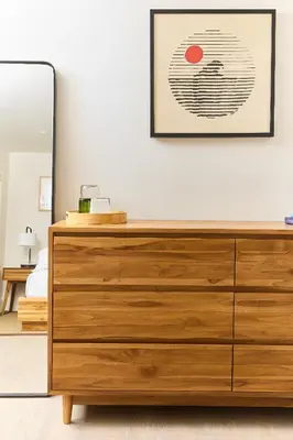 a wooden dresser in a bedroom with a mirror at Laguna Surf Lodge by SCP Hotels in Laguna Beach