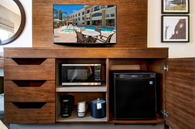 a kitchen with a microwave and a tv on a counter at Hampton Inn & Suites by Hilton Hemet Menifee Murrieta in Hemet