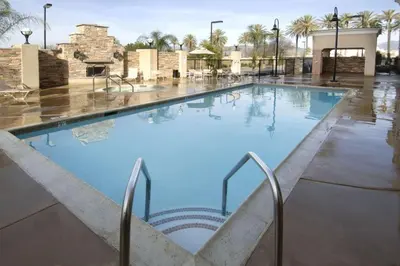 a large swimming pool with blue water at Hampton Inn & Suites by Hilton Hemet Menifee Murrieta in Hemet