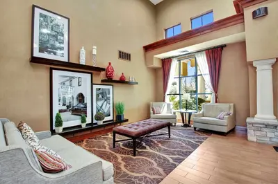 a living room with couches and chairs and a fireplace at Hampton Inn & Suites by Hilton Hemet Menifee Murrieta in Hemet