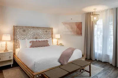 a bedroom with a large white bed and a window at Cardiff By The Sea Lodge in Encinitas