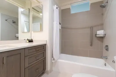 a bathroom with a tub and a toilet and a sink at Wave Crest Resort in San Diego