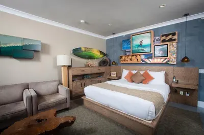 a bedroom with a bed and a couch in a room at La Casa Del Camino in Laguna Beach