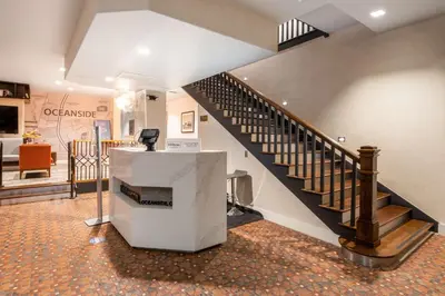 a room with a staircase and a stair case at The Fin Hotel, Tapestry Collection by Hilton in Oceanside