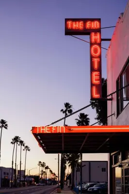 a neon sign that says the end on a building at The Fin Hotel, Tapestry Collection by Hilton in Oceanside