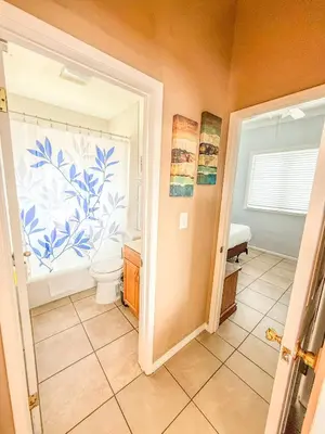 a bathroom with a toilet and a window at 3bd Little Italy Cottage A++ Location in San Diego