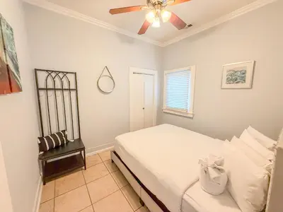 a bedroom with a bed and a ceiling fan at 3bd Little Italy Cottage A++ Location in San Diego
