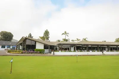 a view of the clubhouse from the putting green at Lakehouse Resort in San Marcos
