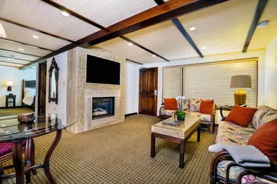 a living room with a couch and a fireplace at Pantai Inn in San Diego