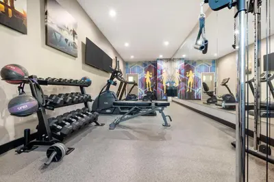 a gym with several treadmills and exercise equipment at Best Western Plus Temecula Wine Country Hotel & Suites in Temecula