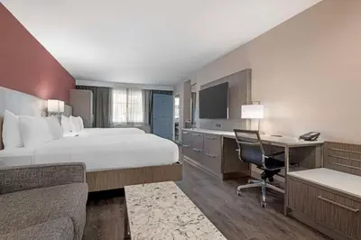 a hotel room with a bed and a desk at Best Western Plus Temecula Wine Country Hotel & Suites in Temecula