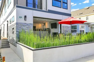 a red umbrella in front of a house at 308 35th Street, Unit A (Lower) in Newport Beach