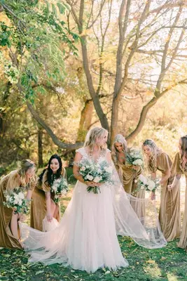 a bride and her bridal party in the woods at San Vicente Golf Resort in Ramona
