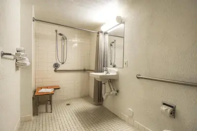 a bathroom with a sink and a shower at Motel 6-San Ysidro, CA - San Diego - Border in San Ysidro, San Diego
