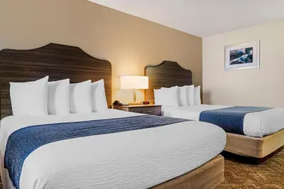 a hotel room with two beds and two lamps at Best Western Santee Lodge in Santee