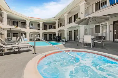 a swimming pool in the courtyard of a hotel at Best Western Santee Lodge in Santee