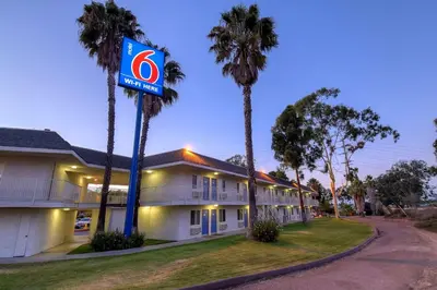 a building with a no parking sign in front of it at Motel 6-San Diego, CA - North in San Diego