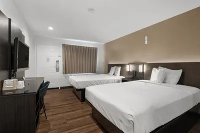 a hotel room with two beds and a television at Motel 6-Escondido, CA in Escondido