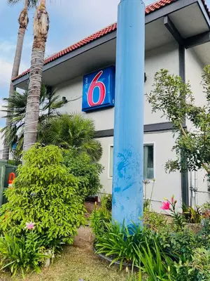 a gas station with a sign on the side of it at Motel 6-La Mesa, CA - San Diego in La Mesa
